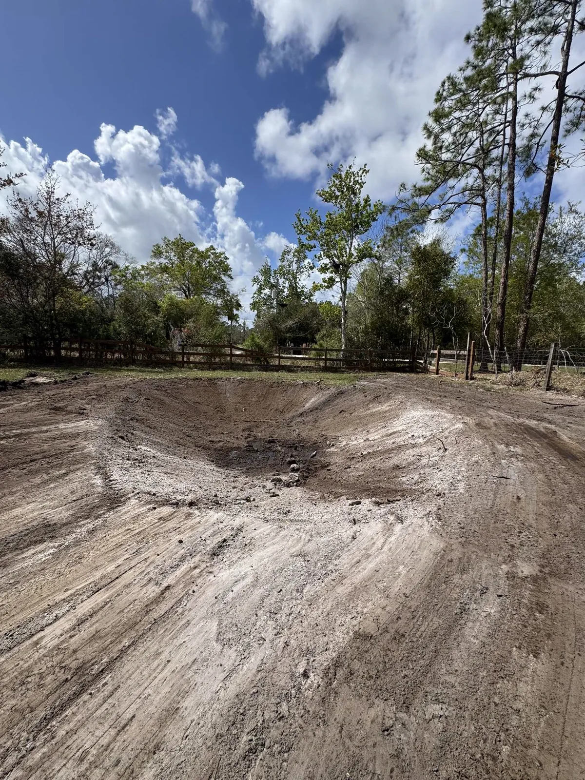 Small retention pond being excavated by Dirt Dynamics in Central Florida