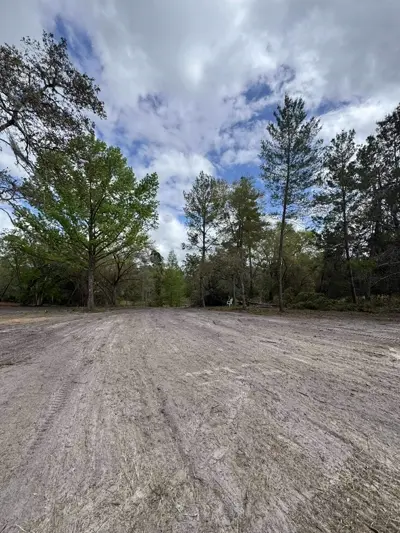 Cleared residential lot after full property cleanup including brush removal and concrete demolition by Dirt Dynamics