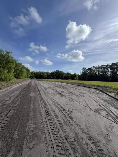 Rough grading work on a residential lot using heavy equipment by Dirt Dynamics