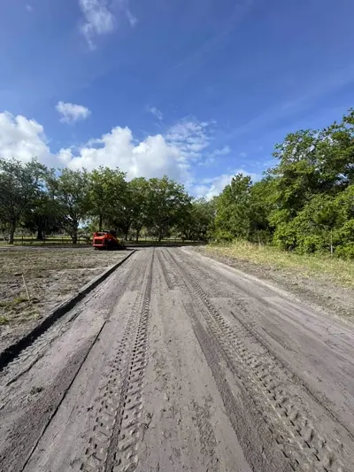 Cut and fill earthmoving operation on a sloped property by Dirt Dynamics