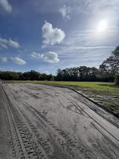 Swale grading for drainage management on a residential property by Dirt Dynamics