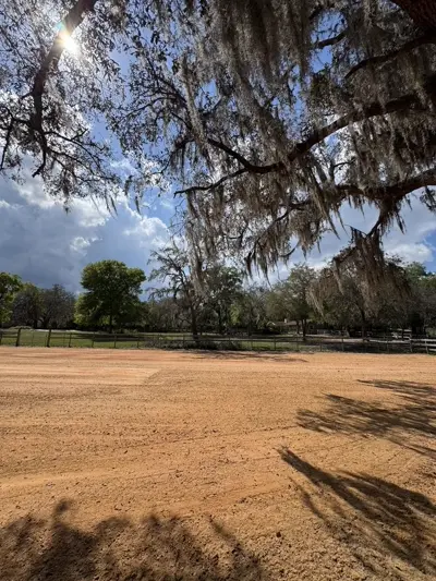 Completed horse riding arena with clay-sand mix surface built by Dirt Dynamics LLC